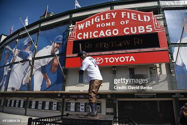 The Ernie Banks statue wears a jersey on October 8, 2015 outside Wrigley Field in Chicago, Illinois.