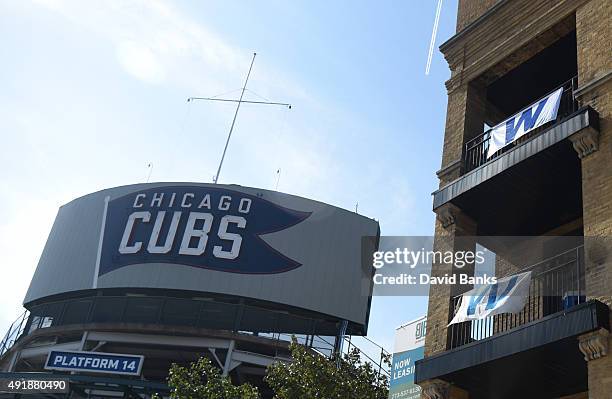 Win sign flies on a balconies supporting the Chicago Cubs on October 8, 2015 around Wrigley Field in Chicago, Illinois.