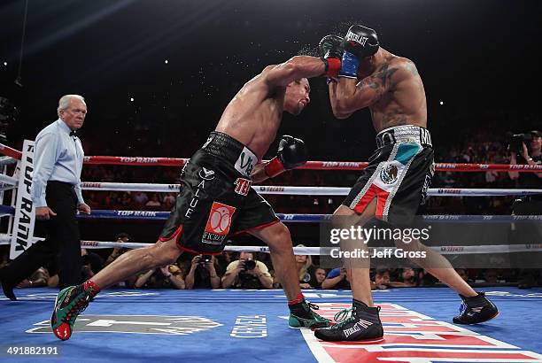 Juan Manuel Marquez lands a right hand to the head of Mike Alvarado at The Forum on May 17, 2014 in Inglewood, California.