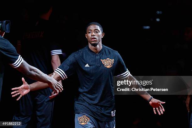 Brandon Knight of the Phoenix Suns high-fives teammates as he is introduced to the preseason NBA game against the Sacramento Kings at Talking Stick...