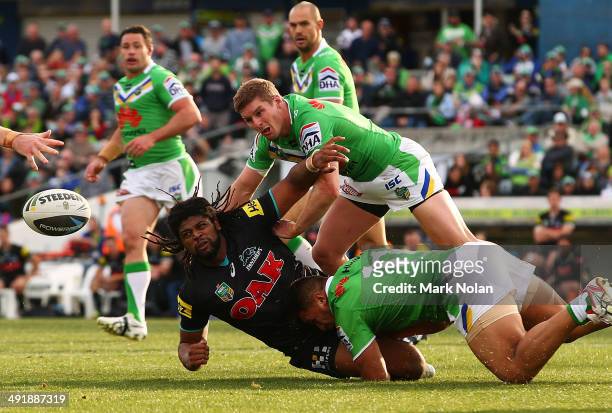 Jamal Idris of the Panthers offloads the ball during the round 10 NRL match between the Canberra Raiders and the Penrith Panthers at GIO Stadium on...