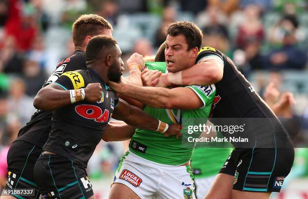 James Segeyaro of the Panthers and David Shillington of the Raiders fight during the round 10 NRL match between the Canberra Raiders and the Penrith...