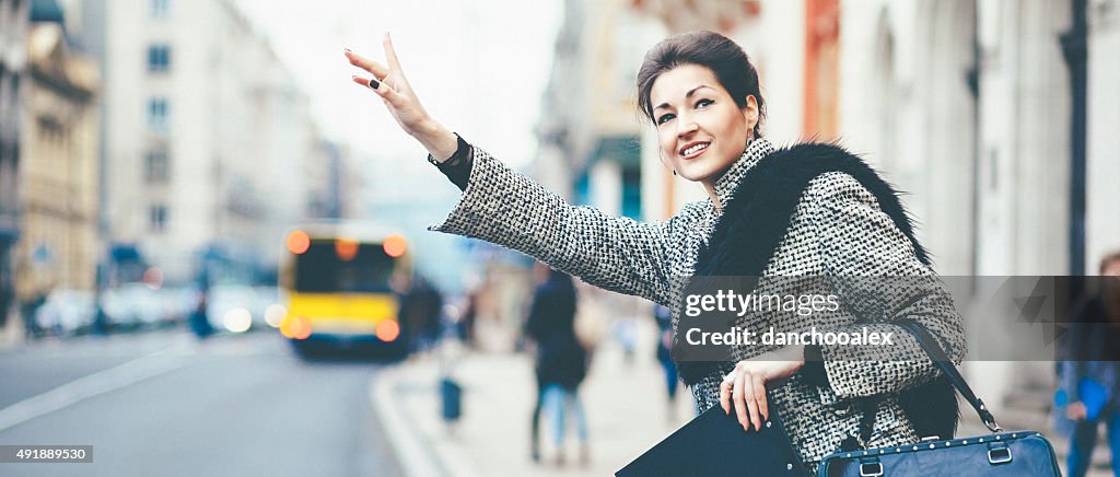 Businesswoman waiting for taxi