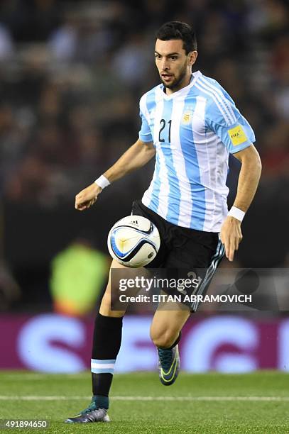 Argentina's midfielder Javier Pastore drives the ball during the Russia 2018 FIFA World Cup qualifiers match against Ecuador, at the Monumental...