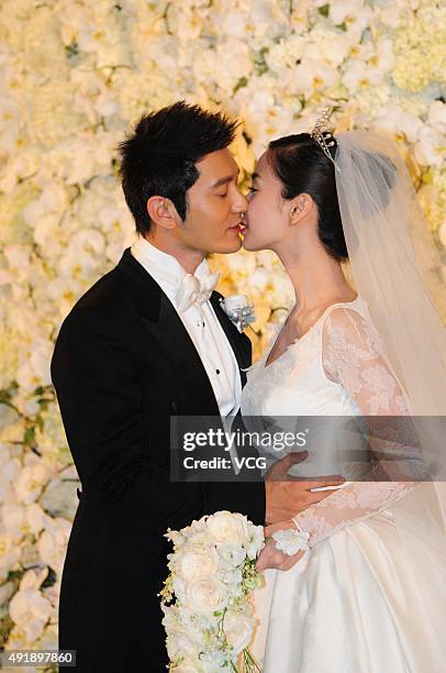 Huang Xiaoming and Anglababy during their wedding ceremony at Shanghai Exhibition Center on October 8, 2015 in Shanghai, China.