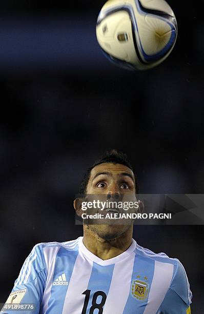 Argentina's forward Carlos Tevez eyes the ball during their Russia 2018 FIFA World Cup qualifiers match against Ecuador, at the Monumental stadium in...