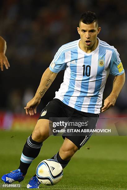 Argentina's forward Sergio Aguero drives the ball during their Russia 2018 FIFA World Cup qualifiers match against Ecuador, at the Monumental stadium...
