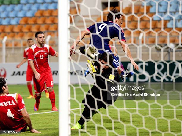 Shinji Okazaki of Japan scores his team's second goal during the 2018 FIFA World Cup Asian Group E qualifying match between Syria and Japan at Seeb...