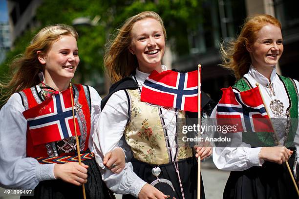 Group of girls with traditional dresses parading to celebrate Norwegian Constitution Day on May 17, 2014 in Oslo, Norway. Norway's Constitution,...