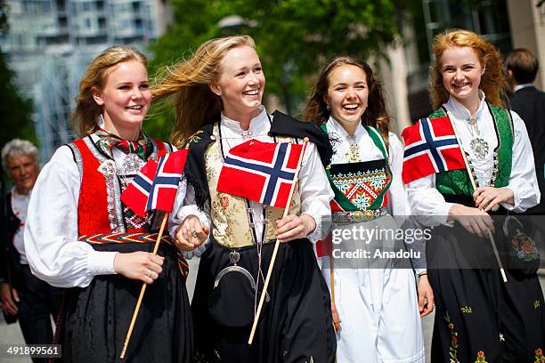 Group of girls with traditional dresses parading to celebrate Norwegian Constitution Day on May 17, 2014 in Oslo, Norway. Norway's Constitution,...