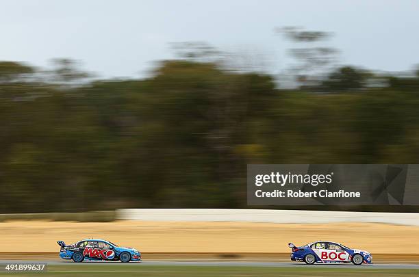 Jason Bright driving the Team BOC Holden is chased by Chaz Mostert driving the Pepsi Max Crew Ford during race 15 at the Perth 400, which is round...