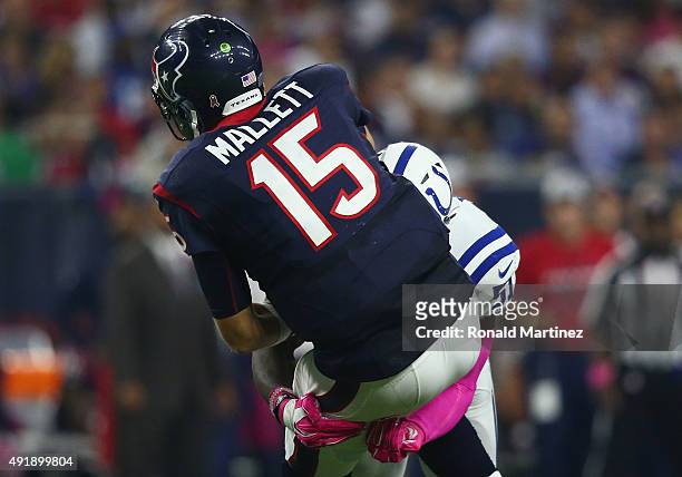 Ryan Mallett of the Houston Texans is tackled by Sio Moore of the Indianapolis Colts in the second quarter at NRG Stadium on October 8, 2015 in...