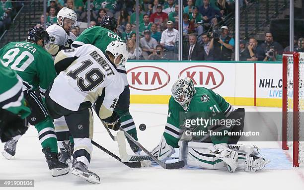 Antti Niemi of the Dallas Stars blocks a shot by Beau Bennett of the Pittsburgh Penguins in the second period at American Airlines Center on October...