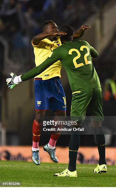 Alexander Dominguez goalkeeper of Ecuador celebrates with teammate Walter Ayovi the first goal of his team during a match between Argentina and...