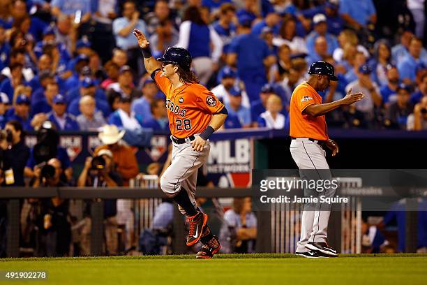 Colby Rasmus of the Houston Astros runs the bases after hitting a solo home run in the eighth inning against the Kansas City Royals during game one...