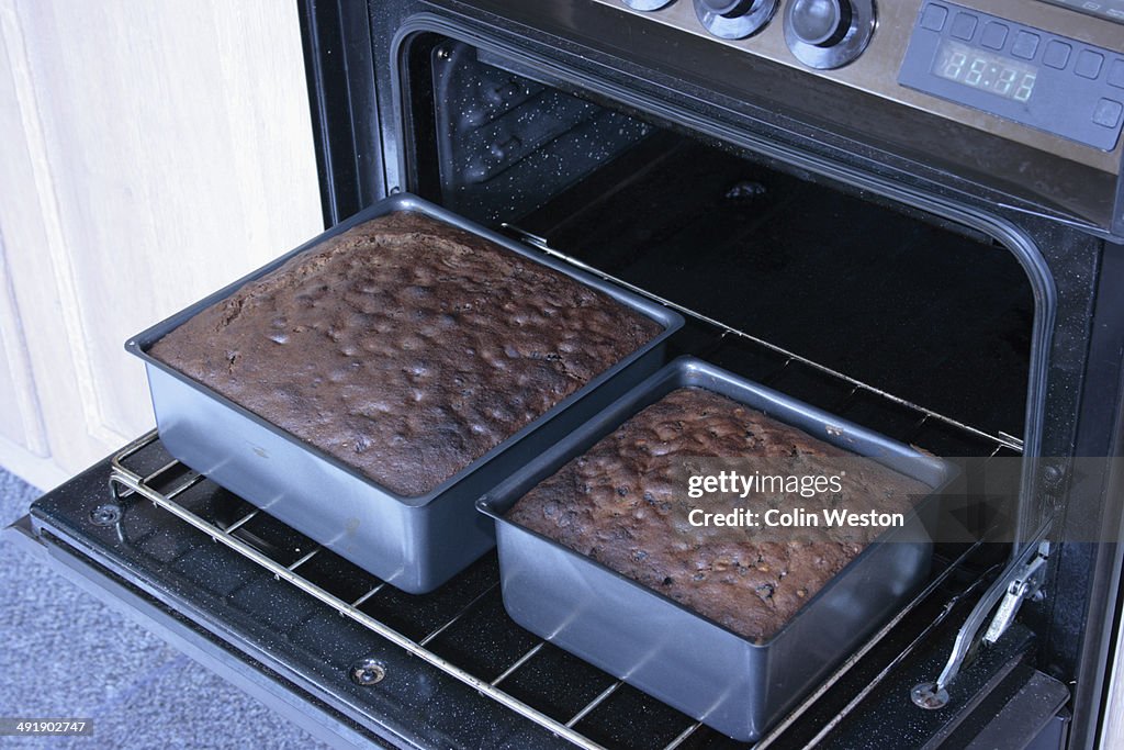 Removing the wedding cakes from the oven