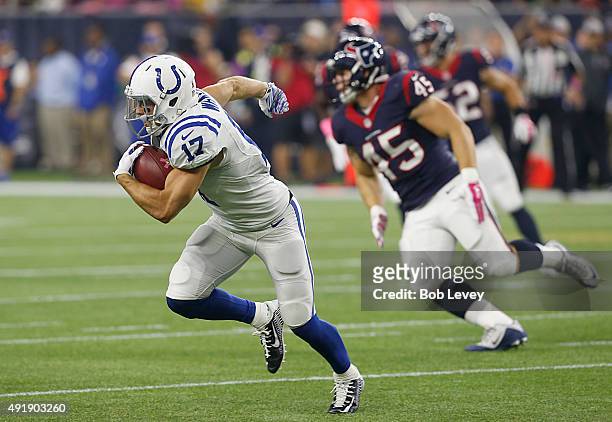 Griff Whalen of the Indianapolis Colts runs after the catch while Jay Prosch of the Houston Texans chases in the third quarter on October 8, 2015 at...