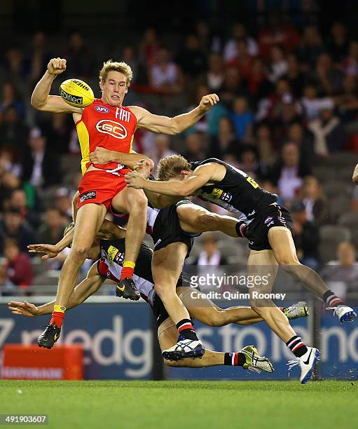Tom Lynch of the Suns crashes into a pack as Jimmy Webster of the Saints attempts to mark during the round nine AFL match between the St Kilda Saints...