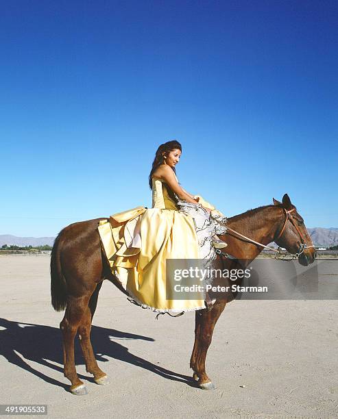 girl dressed for her quinceanera, on horse - カリオルニア州アップルバレー ストックフォトと画像