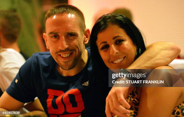 Bayern Munich's French midfielder Franck Ribery and his wife Wahiba attend the club's party after winning the final football match of the German Cup...