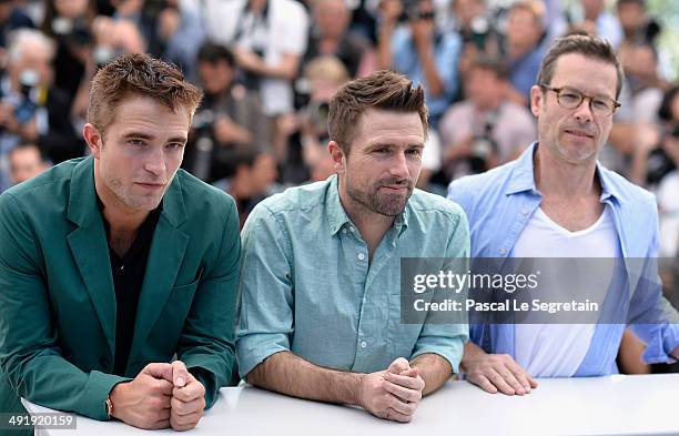 Actor Robert Pattinson, director David Michod and actor Guy Pearce attend "The Rover" photocall during the 67th Annual Cannes Film Festival on May...