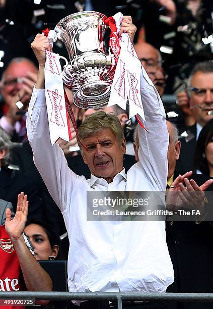 Arsene Wenger, manager of Arsenal celebrates as he lifts the FA Cup after the FA Cup with Budweiser Final match between Arsenal and Hull City at...