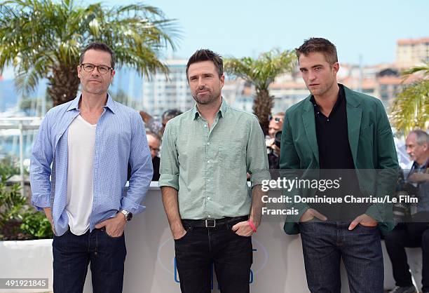 Actor Guy Pearce, director David Michod and actor Robert Pattinson attend "The Rover" photocall at the 67th Annual Cannes Film Festival on May 18,...