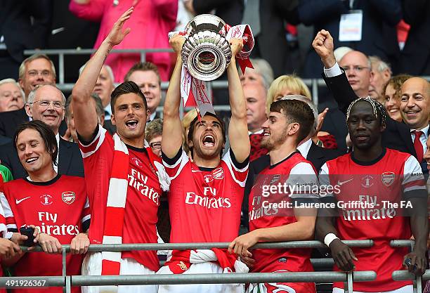 Mathieu Flamini of Arsenal celebrates as he lifts the trophy next to team-mates during the FA Cup with Budweiser Final match between Arsenal and Hull...