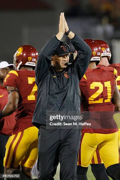 Steve Sarkisian Head Coach of USC signals during the first half of a game against the Washington Huskies at Los Angeles Memorial Coliseum on October...