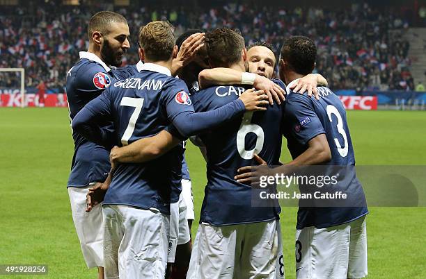 Yohan Cabaye of France celebrates his goal with teammates Karim Benzema, Mathieu Valbuena during the international friendly match between France and...