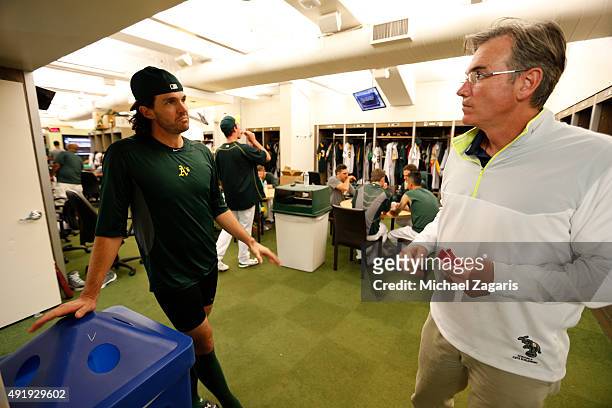 Barry Zito and General Manager Billy Beane of the Oakland Athletics talk in the clubhouse prior to the game against the Texas Rangers at O.co...