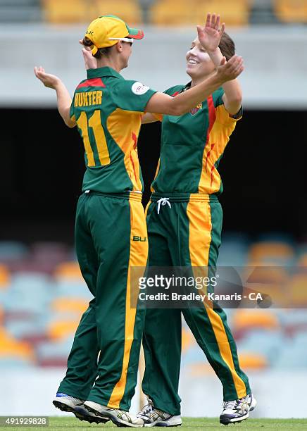 Katelyn Fryett and Julie Hunter of Tasmania celebrate after taking the wicket of Claire Koski of the ACT during the round one WNCL match between ACT...