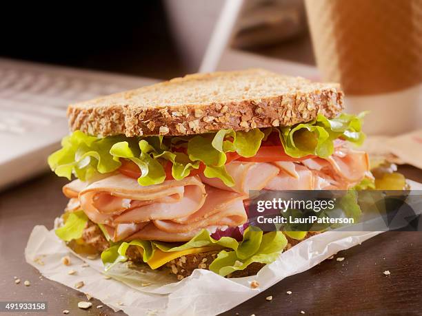 turkey sandwich at your desk - toasted sandwich stockfoto's en -beelden