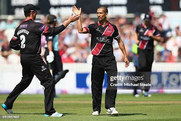 Alfonso Thomas of Somerset celebrates with Marcus Trescothick after captring the wicket of Jason Roy of Surrey during the NatWest T20 Blast match...