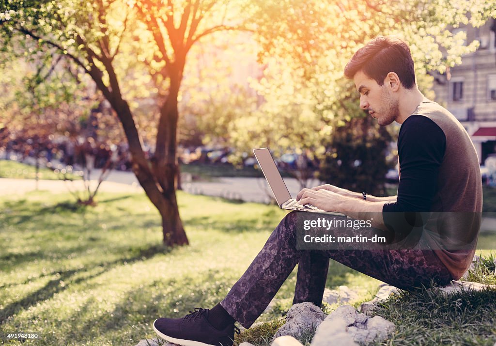 Young man using lap top