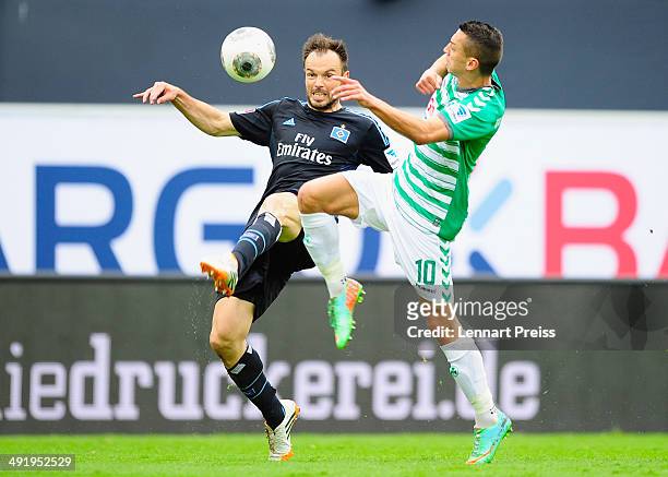 Nikola Djurdjic of Fuerth challenges Heiko Westermann of Hamburg during the Bundesliga Playoff Second Leg match between SpVgg Greuther Fuerth and...