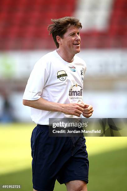 Darren Anderton of 'Super Spurs' runs off the pitch during the Football30 Elite Legends Tournament at Brisbane Road on May 18, 2014 in London,...