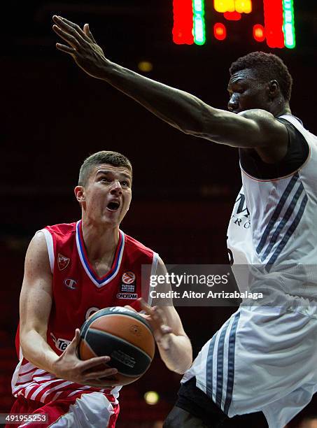 Vojislav Stojanovic, #9 of Crvena Zvezda TelekomcoBelgrade competes with Wally Niang, #16 of Real Madrid during the Nike International Junior...