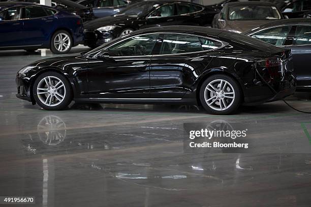 New Tesla Model S automobiles stand in a delivery area ahead of European shipping following final assembly at the Tesla Motors Inc. Factory in...