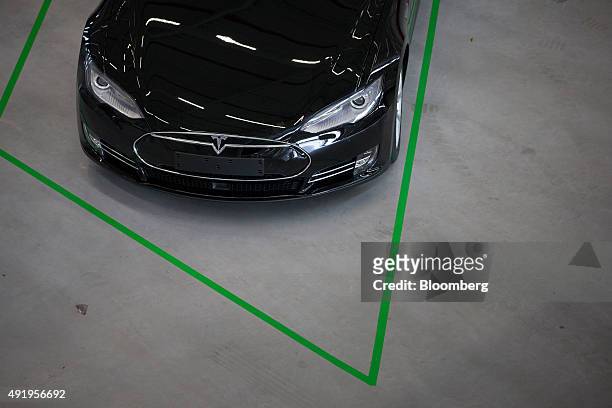 New Tesla Model S automobile stands in a delivery area ahead European shipping following final assembly at the Tesla Motors Inc. Factory in Tilburg,...