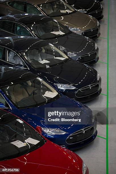 New Tesla Model S automobiles stand in a delivery area ahead of European shipping following final assembly at the Tesla Motors Inc. Factory in...