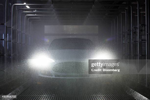 Tesla Model S automobile undergoes rain testing at the Tesla Motors Inc. Factory in Tilburg, Netherlands, on Thursday, Oct. 8, 2015. Tesla said it...