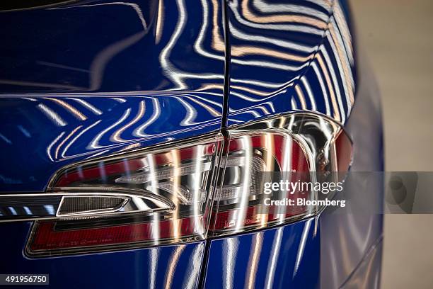 Tesla Model S automobile stands in a light tunnel during quality control checks ahead of European shipping from the Tesla Motors Inc. Factory in...