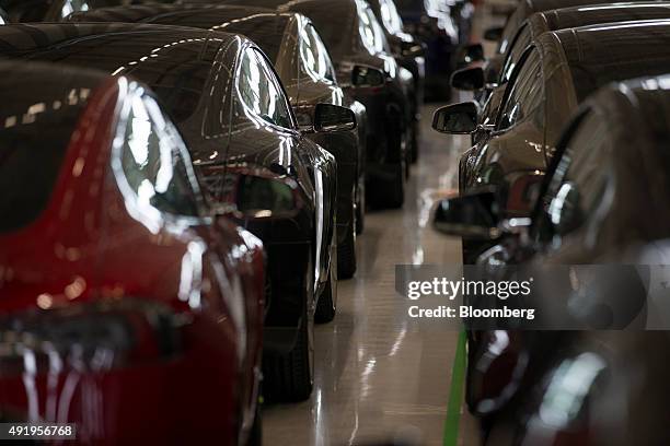 New Tesla Model S automobiles stand in a delivery area ahead of European shipping following final assembly at the Tesla Motors Inc. Factory in...