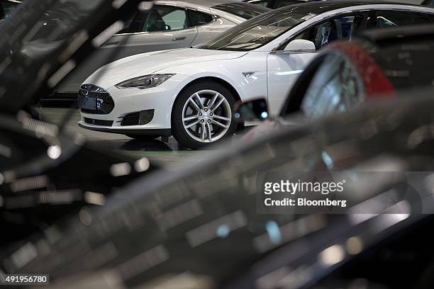 New Tesla Model S automobiles stand in a delivery area ahead of European shipping following final assembly at the Tesla Motors Inc. Factory in...