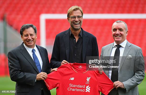 Jurgen Klopp at Anfield is unveiled as the new manager of Liverpool FC as he stands alongside Tom Werner the chairman and Ian Ayre the chief...