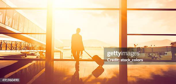 traveller woman waiting - arrival time stock pictures, royalty-free photos & images