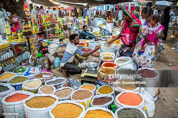 local vegetable and grocery market in india - vendor selling pulses in local market stock pictures, royalty-free photos & images