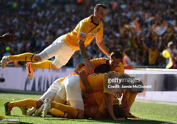 Ryan Donaldson of Cambridge United celebrates his goal with team mates during the Skrill Conference Premier Play-Offs Final between Cambridge United...