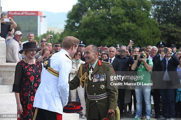 Prince Harry greets Governor General of New Zealand Jerry Mateparae as his wife Lady Janine Mateparae looks on at the Commonwealth War Graves...